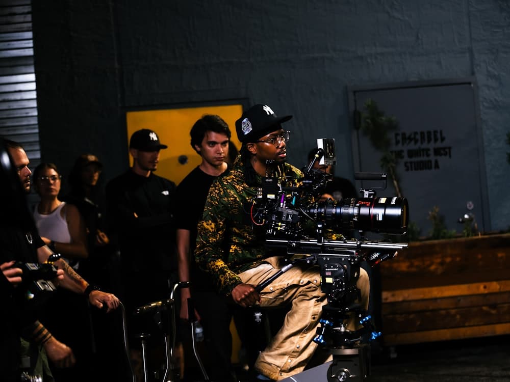 A film crew operating a professional cinema camera on set